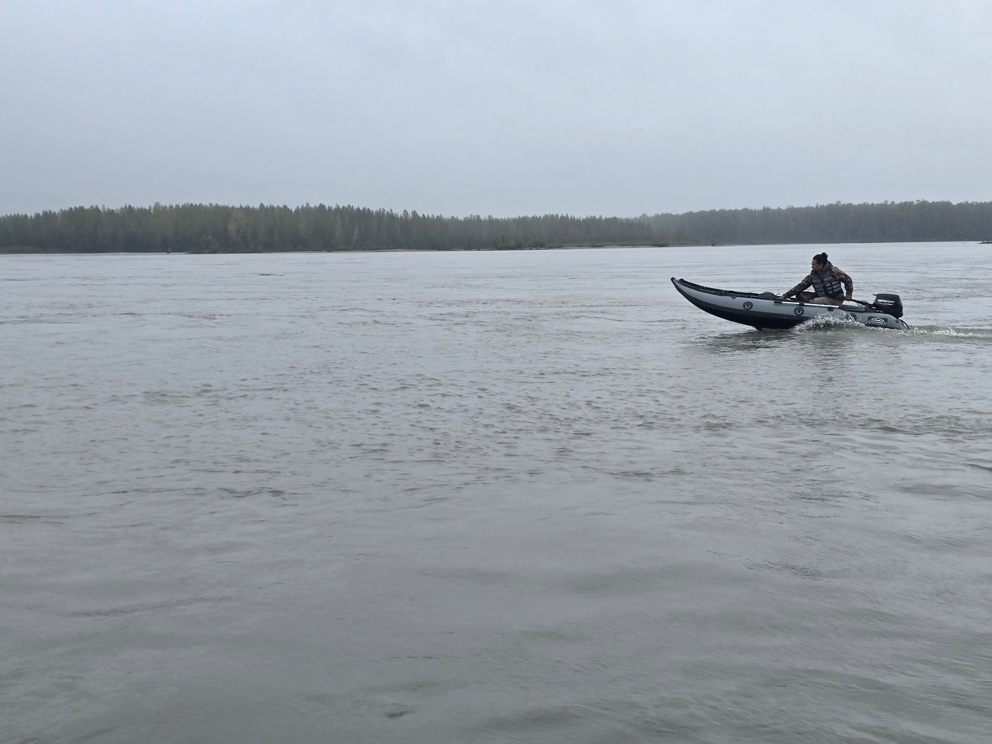 13ft Kaboat inflatable boat floating on Susitna River Alaska — compact Prop-ready design for adventure travel.