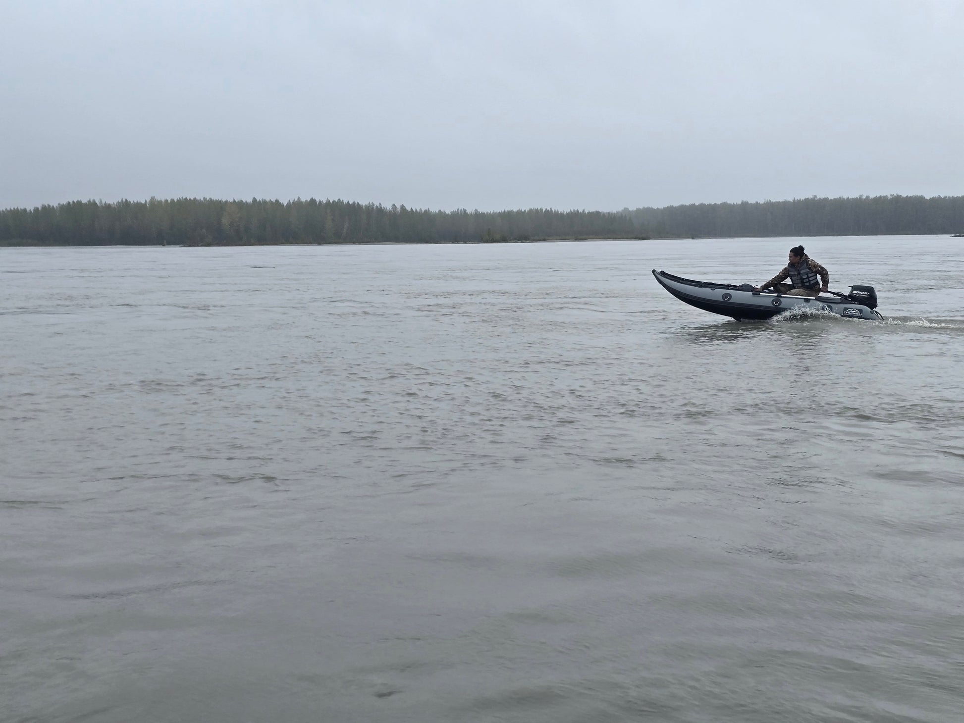 13ft Kaboat inflatable boat floating on Susitna River Alaska — compact Prop-ready design for adventure travel.