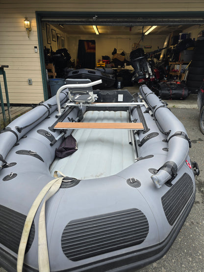 Stryker 420 Inflatable Jet Boat resting on gravel bar along Alaska river — shallow-draft jet boat built for remote backcountry access.