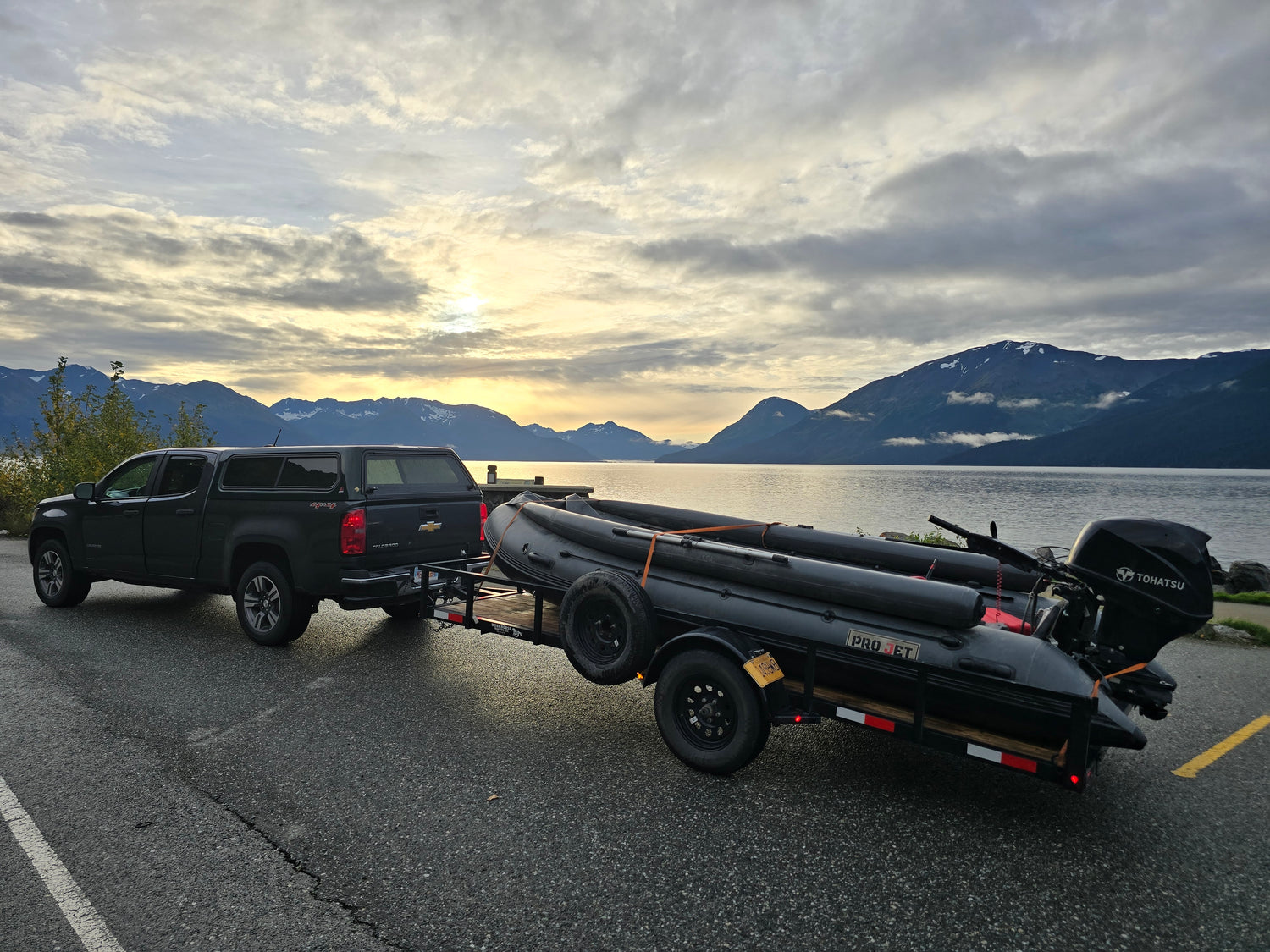 Pro Jet 470 Inflatable Jet Boat on trailer beside Turnagain Arm, Alaska — ready for transport or launch with stunning coastal backdrop.