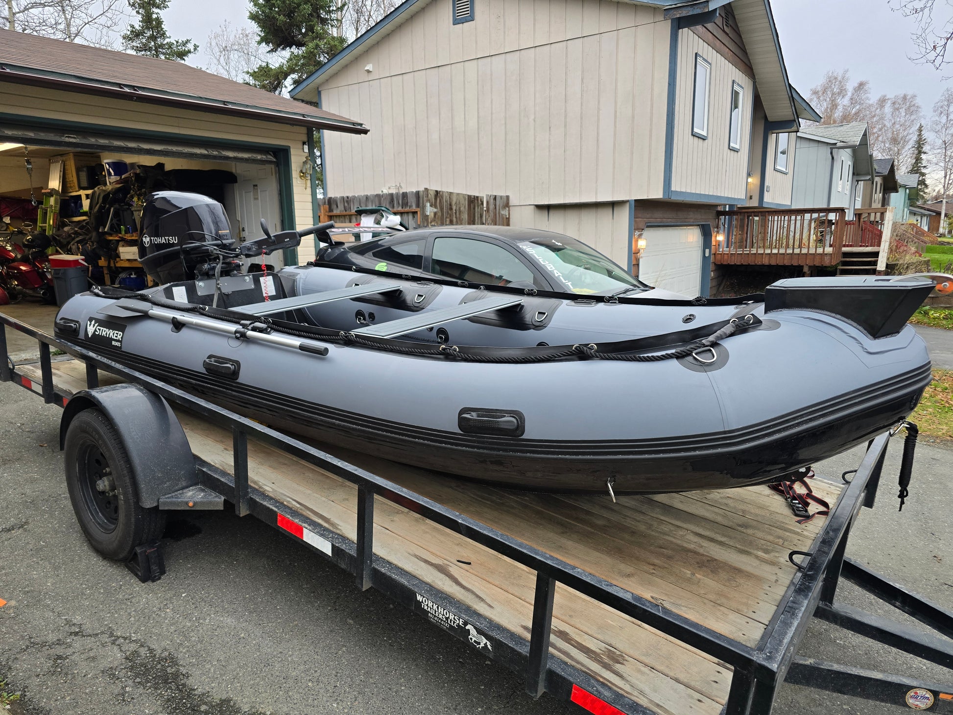 Stryker 420 RIB Jet Tunnel inflatable boat with 60/40 HP Jet Outboard on trailer — solid aluminum hull ready for Alaska launch.