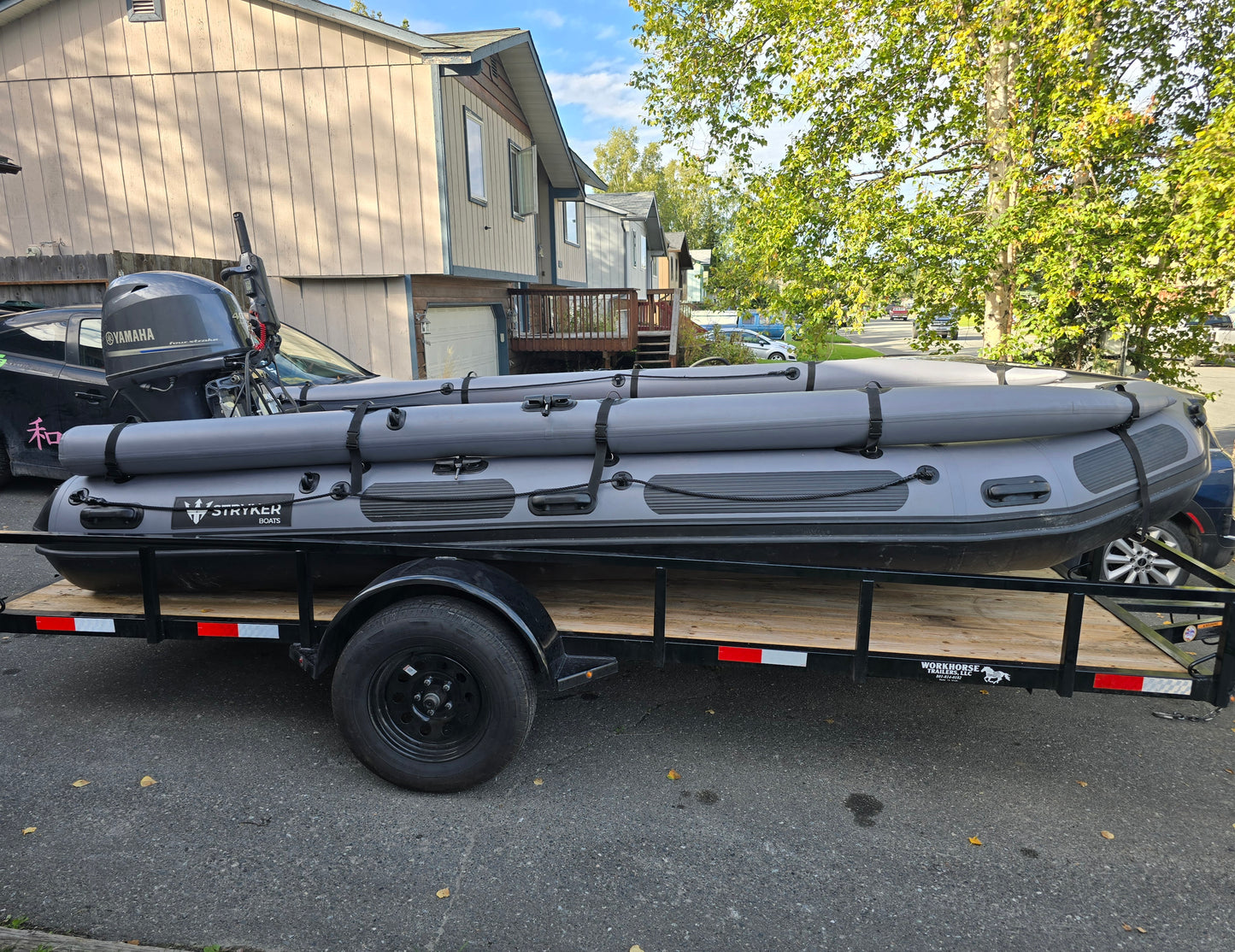 Stryker 470 Inflatable Jet Boat loaded on utility trailer for transport from Anchorage — ready for Alaska Wild Rentals delivery.