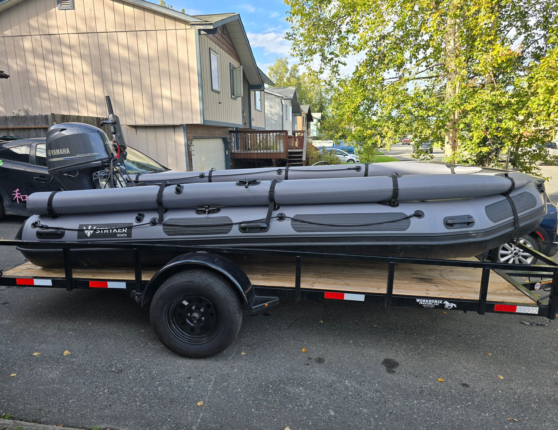 Stryker 470 Inflatable Jet Boat loaded on utility trailer for transport from Anchorage — ready for Alaska Wild Rentals delivery.