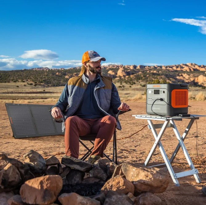 Jackery 1000 Plus Solar Generator powering Starlink Mini and camping gear at a remote Alaska base camp.