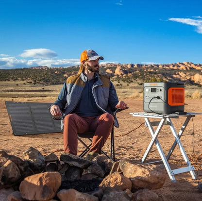 Jackery 1000 Plus Solar Generator powering Starlink Mini and camping gear at a remote Alaska base camp.