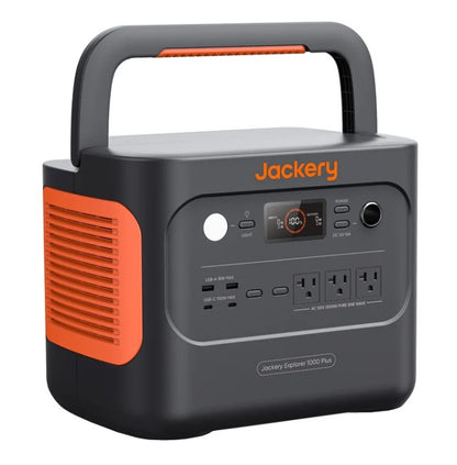 Close view of Jackery 1000 Plus portable power station showing AC DC USB ports and LED display for charging electronics in the field.