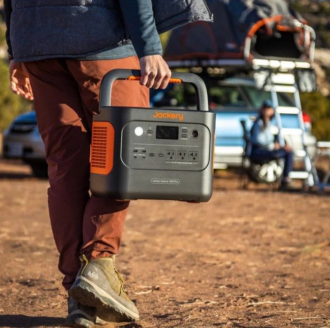 Jackery 1000 Plus Solar Generator running on an inflatable boat during an Alaska river trip for fishing and glacier adventures.